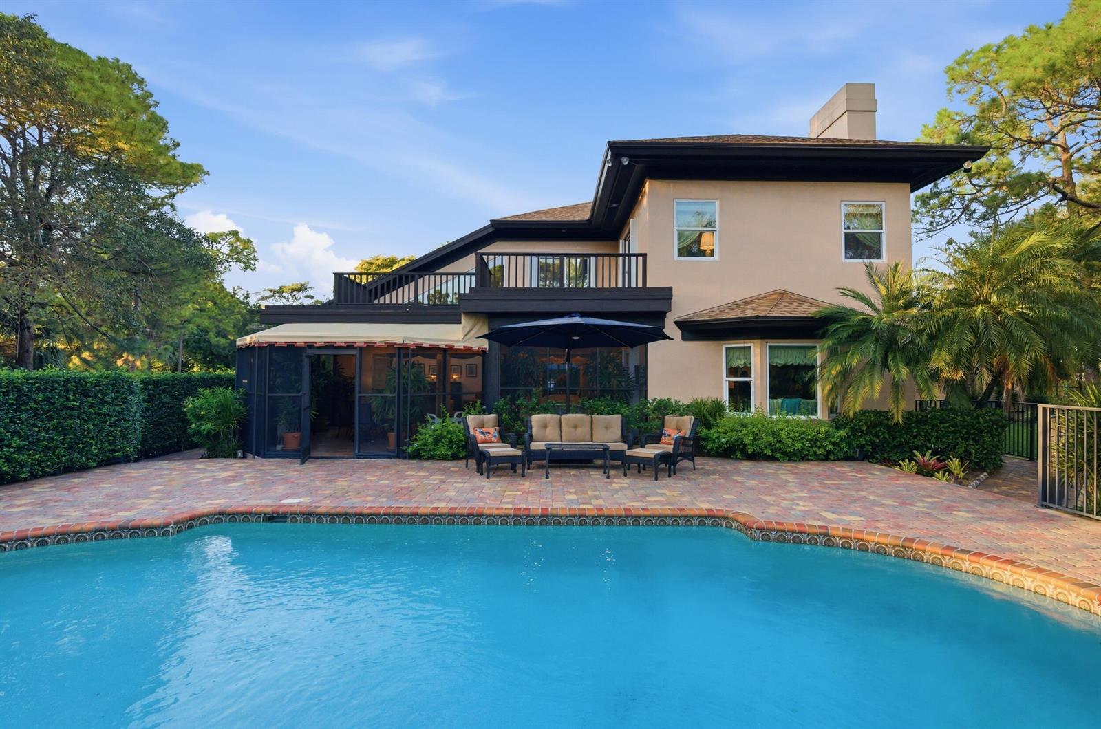 A two-story house with a pool, patio, and a second-floor balcony overlooking the backyard — 4838 Charlton Way, Delray Beach FL 33445, DELRAY BEACH, FL