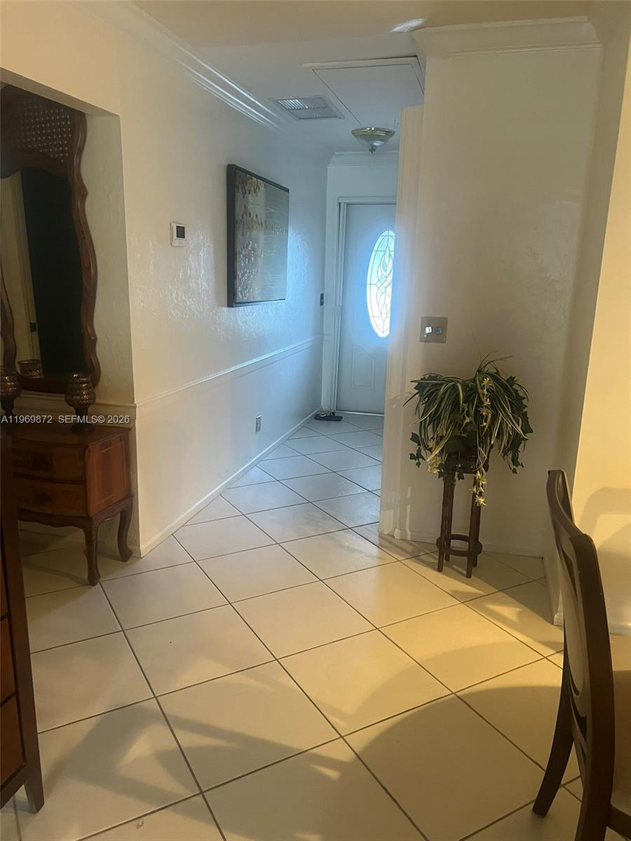 A tiled hallway leads to a front door with a decorative glass insert — 176 Cape Cod Circle # 0, Lake Worth FL 33467, LAKE WORTH, FL