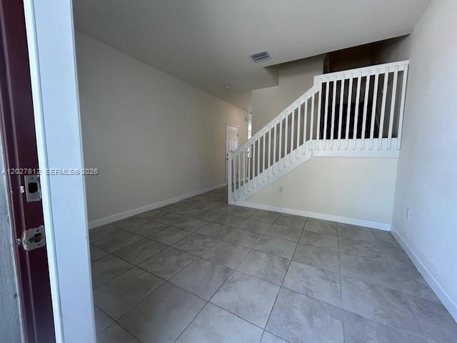 The backyard of a townhouse features a small patio, a lawn, and white vinyl fencing — 3342 W 104th Ter, Hialeah FL 33018, HIALEAH, FL
