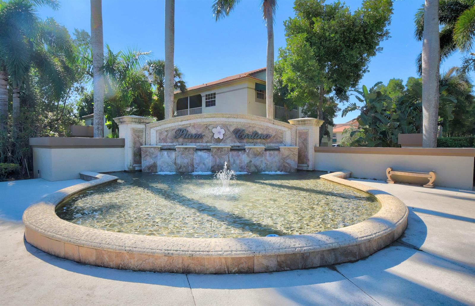 A stone fountain with a central spray sits in front of a community entrance sign — 6770 Via Regina, Boca Raton FL 33433, BOCA RATON, FL
