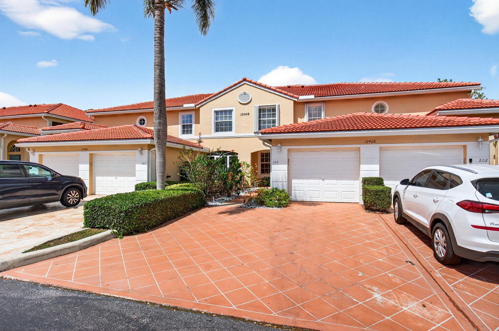A two-story residential building with a red tile roof and a patterned driveway — 12468 Crystal Pointe Drive # 102, Boynton Beach FL 33437, BOYNTON BEACH, FL