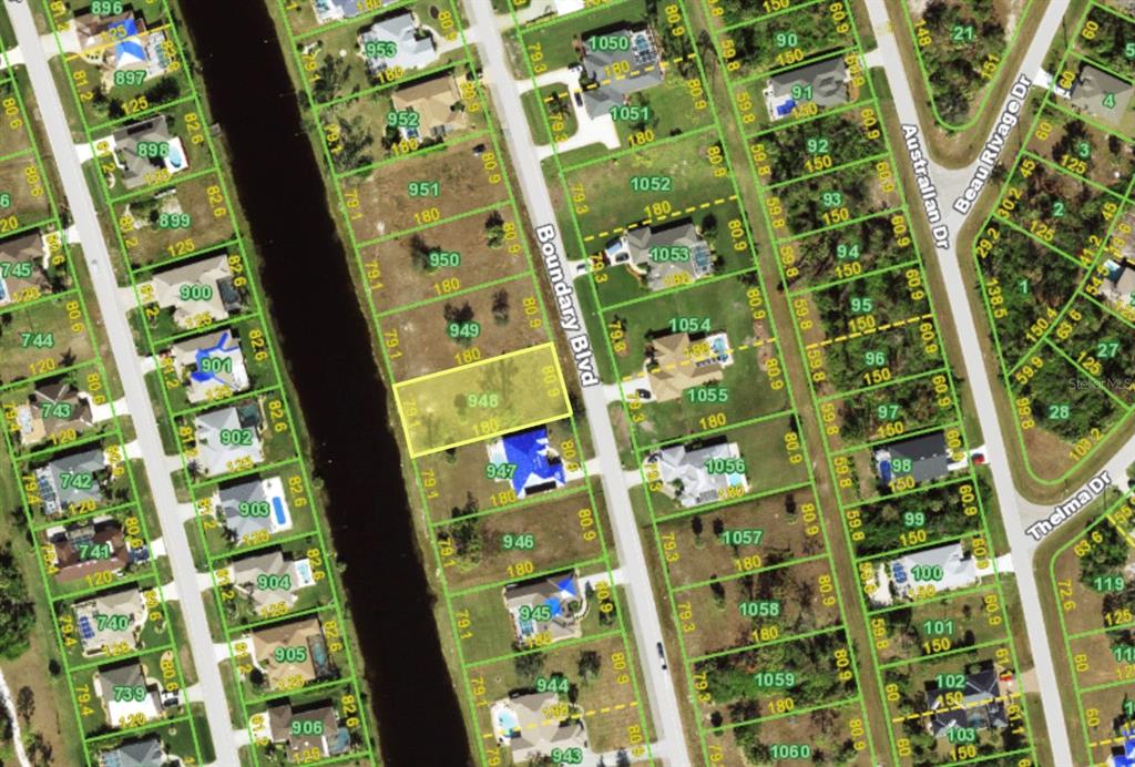 This is an aerial map showing residential lots and a canal in a neighborhood — 828 BOUNDARY BOULEVARD, ROTONDA WEST, FL