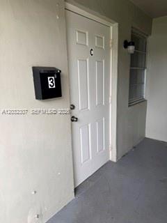 A white exterior door labeled C with a black mailbox numbered 3 on the wall — 7601 Venetian St # 4, Miramar FL 33023, MIRAMAR, FL