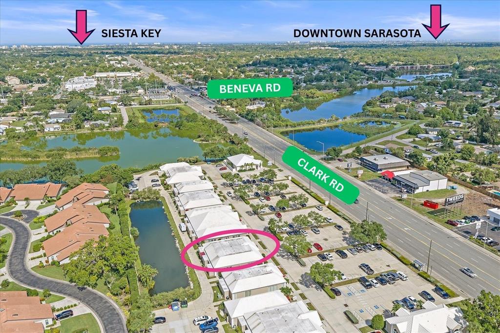 This aerial view shows a commercial building complex located near the intersection of two roads — 3900 CLARK ROAD UNIT D2, SARASOTA, FL