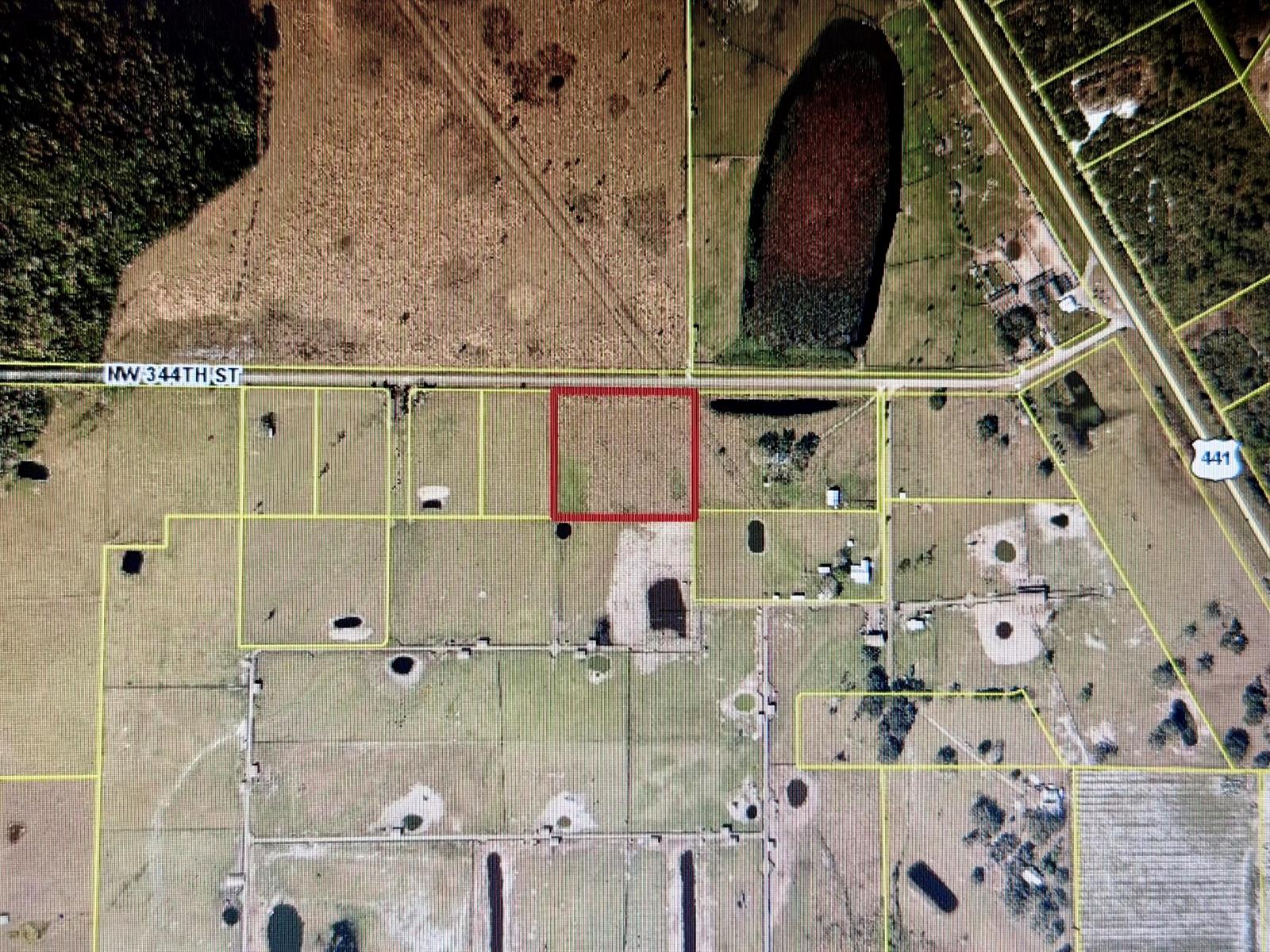 An aerial map view shows a rectangular parcel of land outlined in red along a road — 850 NW 344th Street, Okeechobee FL 34972, OKEECHOBEE, FL