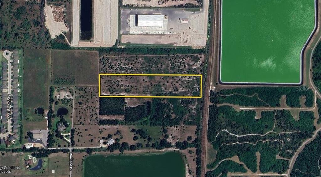 An aerial map view shows a rectangular plot of land outlined in yellow — 3317 ROWLAND DRIVE UNIT Tract F, PUNTA GORDA, FL
