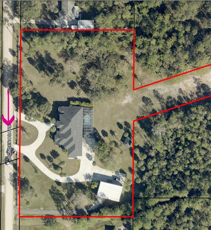 Aerial view of a residential property with a house, pool, and detached garage — PONDEROSA ROAD, MALABAR, FL