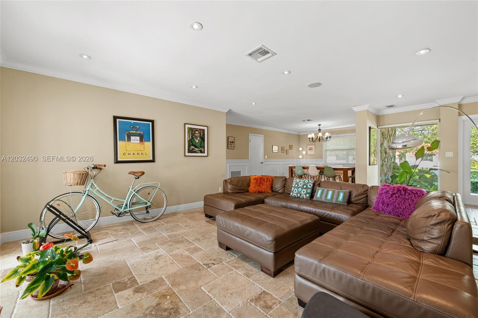 A living room features a large brown sectional sofa, tile flooring, and a decorative bicycle — 7360 SW 115th St, Pinecrest FL 33156, PINECREST, FL