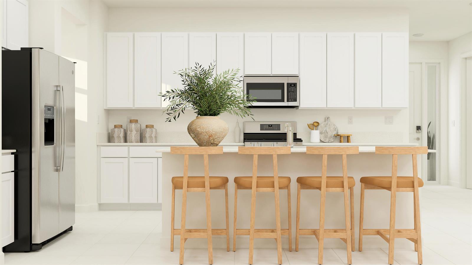A modern kitchen features white cabinetry, stainless steel appliances, a center island, and four wooden stools — 1766 Wandering Willow Way, FL 33470, FL