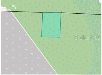 This is a map showing a rectangular parcel of land highlighted in green — 7157 WINDWOOD LANE, MILTON, FL