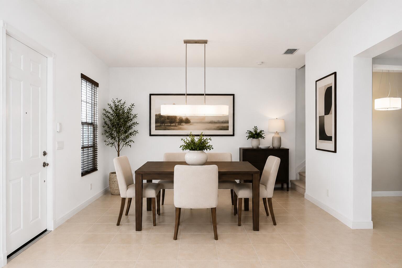 A dining room features a wooden table, four upholstered chairs, and a modern pendant light — 8221 NW 8th Way, Boca Raton FL 33487, BOCA RATON, FL