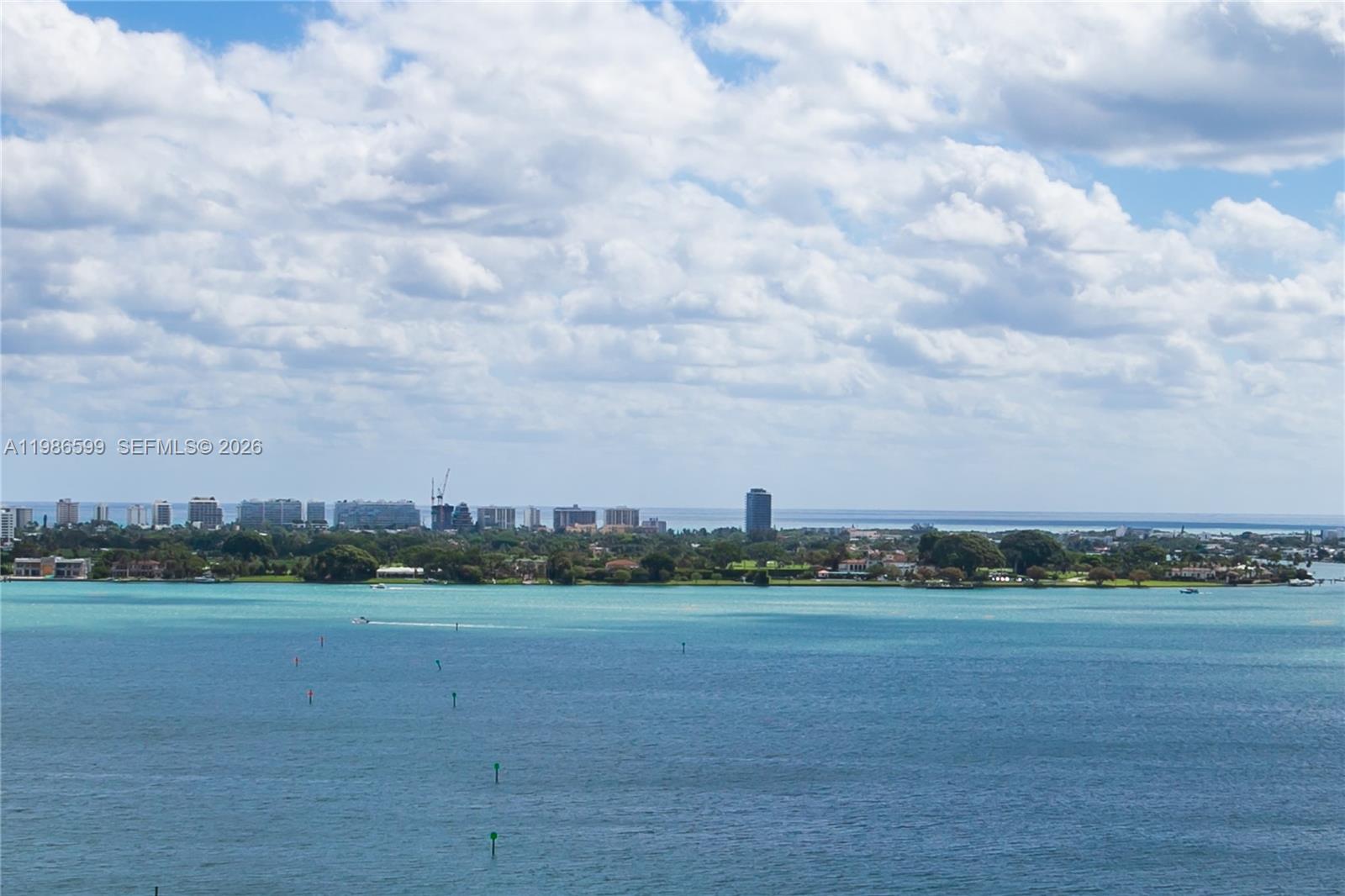 A wide-angle view shows a body of water with a distant city skyline — 1800 NE 114th St # 2309, Miami FL 33181, MIAMI, FL