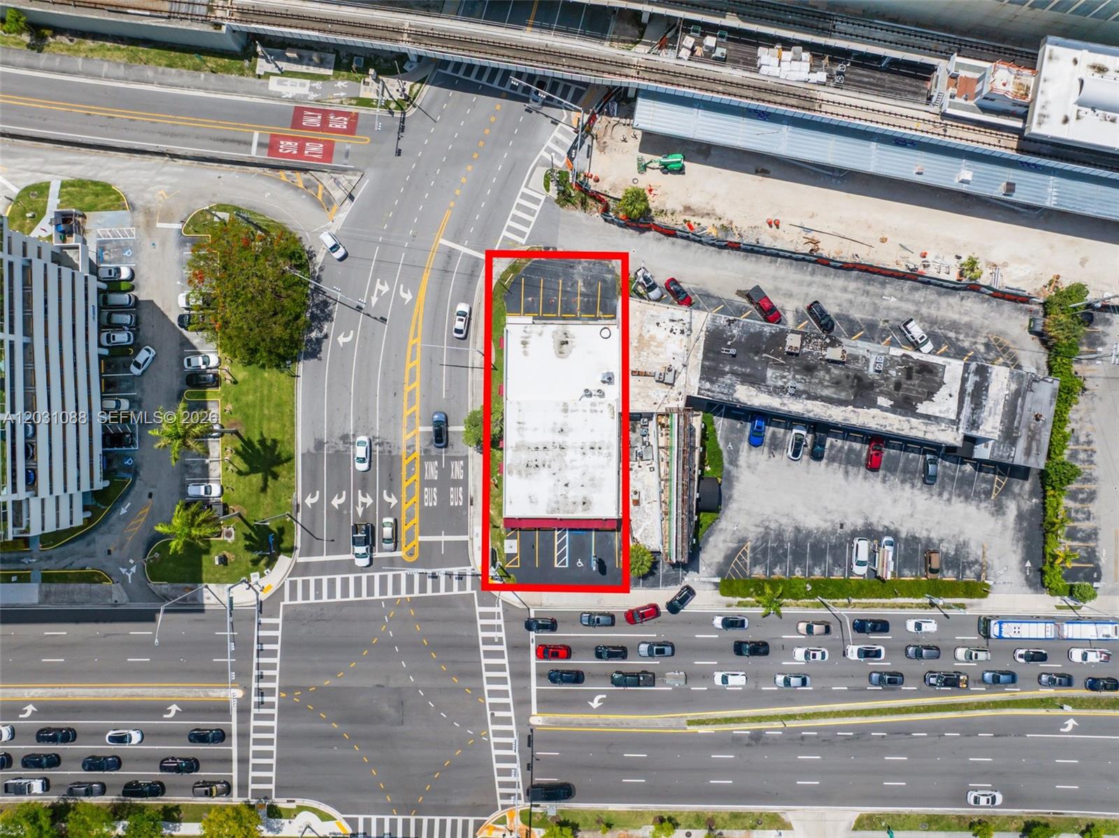 An empty commercial space features a tiled floor, exposed ceiling ductwork, and large glass windows — 9308 S Dixie Hwy, Miami FL 33156, MIAMI, FL