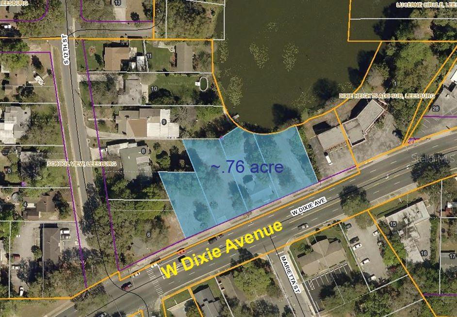 This aerial map shows a highlighted 0.76-acre parcel of land bordering a lake and road — 1024 - 1038 W DIXIE AVENUE, LEESBURG, FL