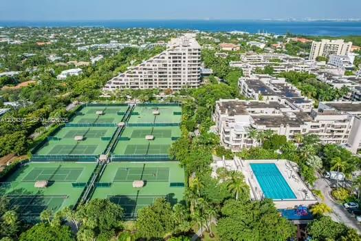 Aerial view of a residential complex featuring multiple tennis courts and a swimming pool — 151 Crandon Blvd # 444, Key Biscayne FL 33149, KEY BISCAYNE, FL