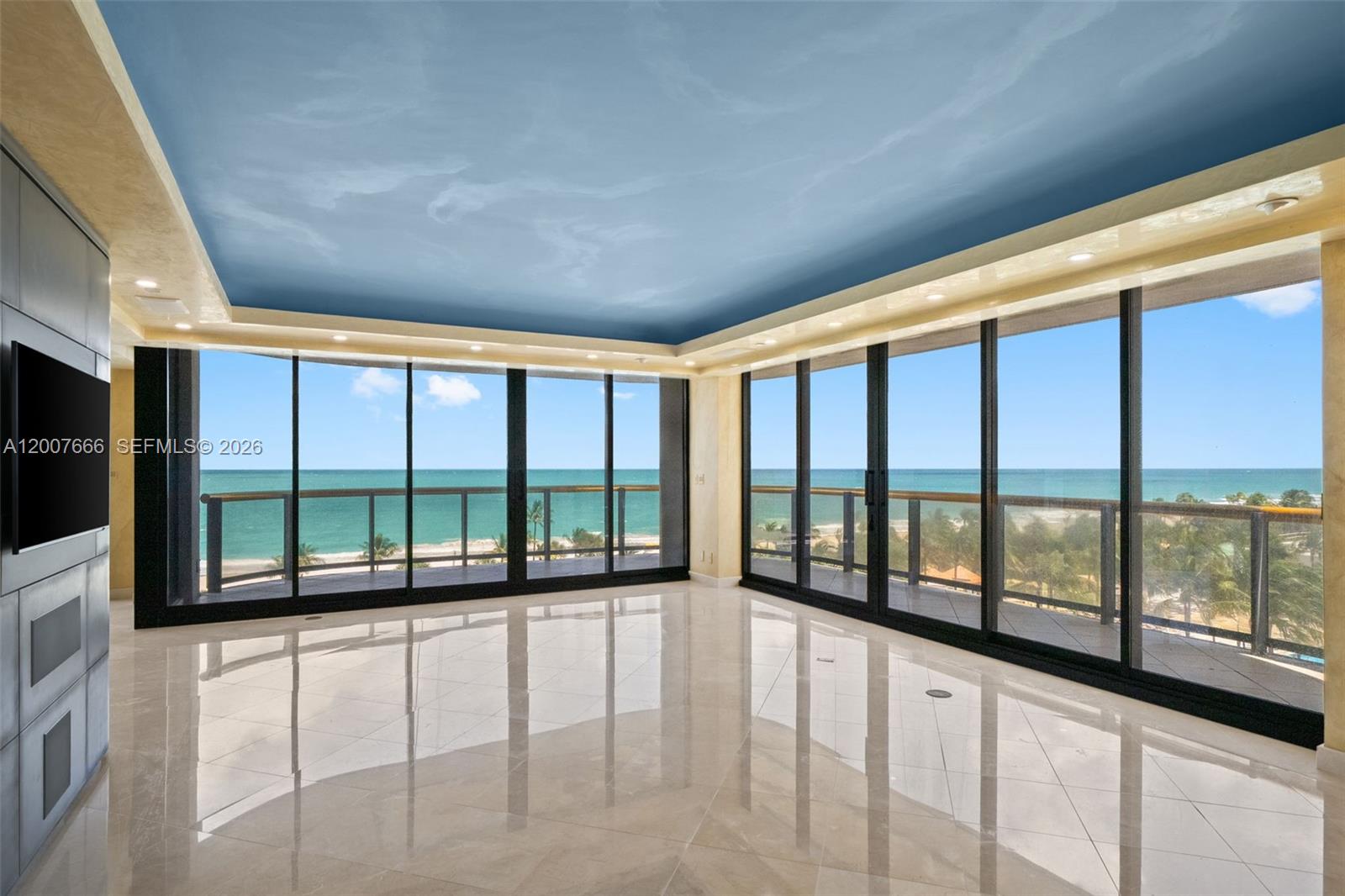 An empty room with light tile floors, a blue ceiling, and floor-to-ceiling windows overlooking the ocean — 9999 Collins Ave # 6G, Bal Harbour FL 33154, BAL HARBOUR, FL