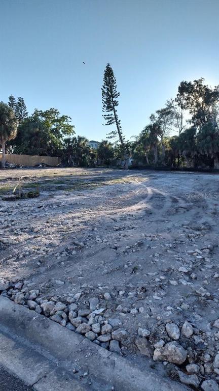 A vacant, cleared residential lot with rocky soil and a tall, thin pine tree — 372 12TH AVENUE, INDIAN ROCKS BEACH, FL