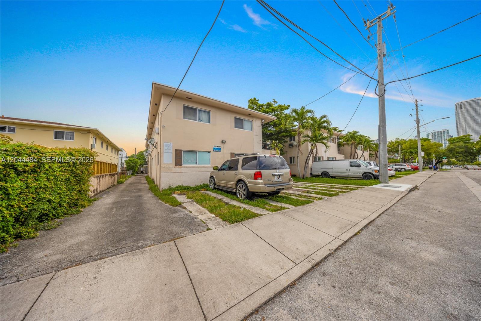 An exterior view of a two-story apartment building with a parking area and sidewalk — 731 SW 5th St, Miami FL 33130, MIAMI, FL