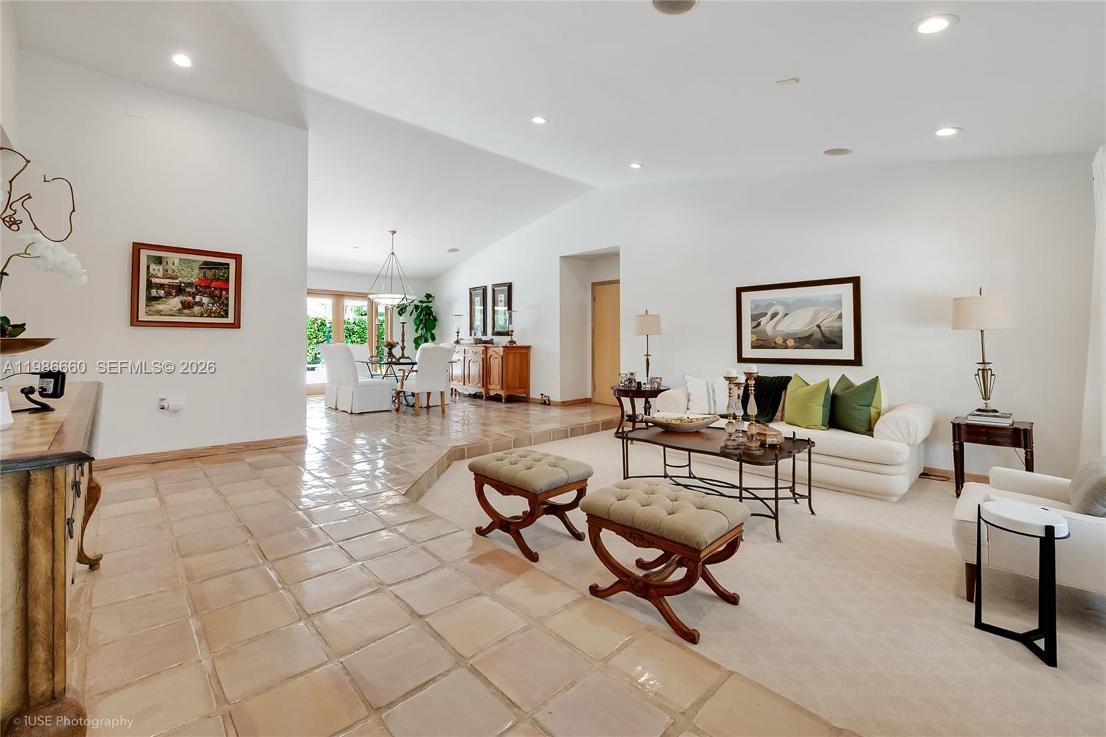 A sunken living room features beige carpeting, tile flooring, and a dining area beyond — 10422 SW 121st St, Miami FL 33176, MIAMI, FL