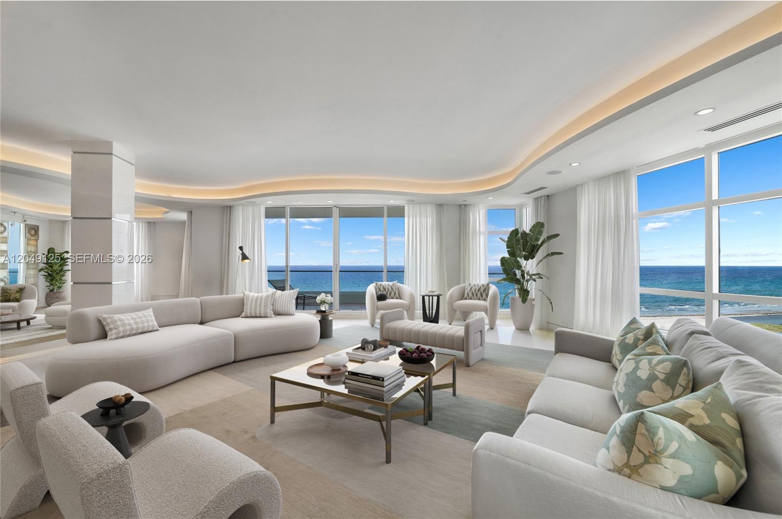 A bright living room features curved ceilings, neutral furniture, and floor-to-ceiling windows overlooking the ocean — 2494 S Ocean Blvd, Boca Raton FL 33432, BOCA RATON, FL