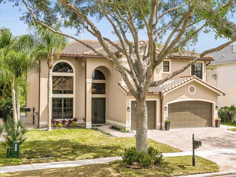 A two-story stucco house with a tile roof and an attached two-car garage — 11737 Preservation Lane, Boca Raton FL 33498, BOCA RATON, FL