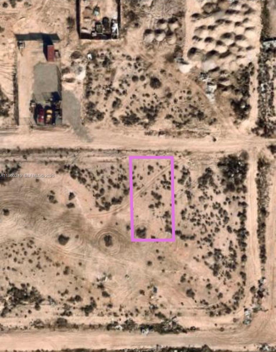 This is an aerial view of a rectangular plot of land outlined in pink — Reverend Wilson Ave, NV 89030, NV