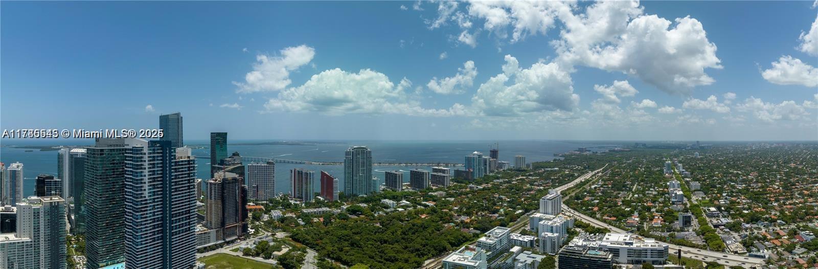 An aerial view shows a dense city skyline with high-rise buildings overlooking a large bay — 1133 SW 2nd Ave # 3217, Miami FL 33130, MIAMI, FL