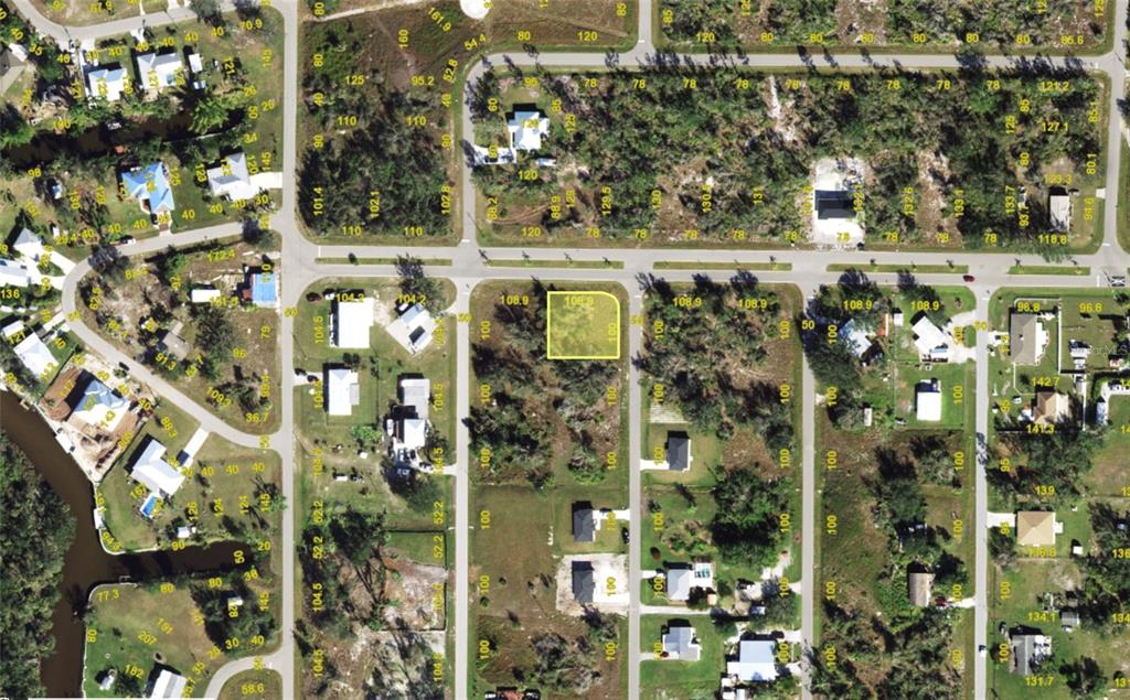 This is an aerial map showing a vacant residential lot highlighted in yellow — 273 BOLENDER STREET, PUNTA GORDA, FL
