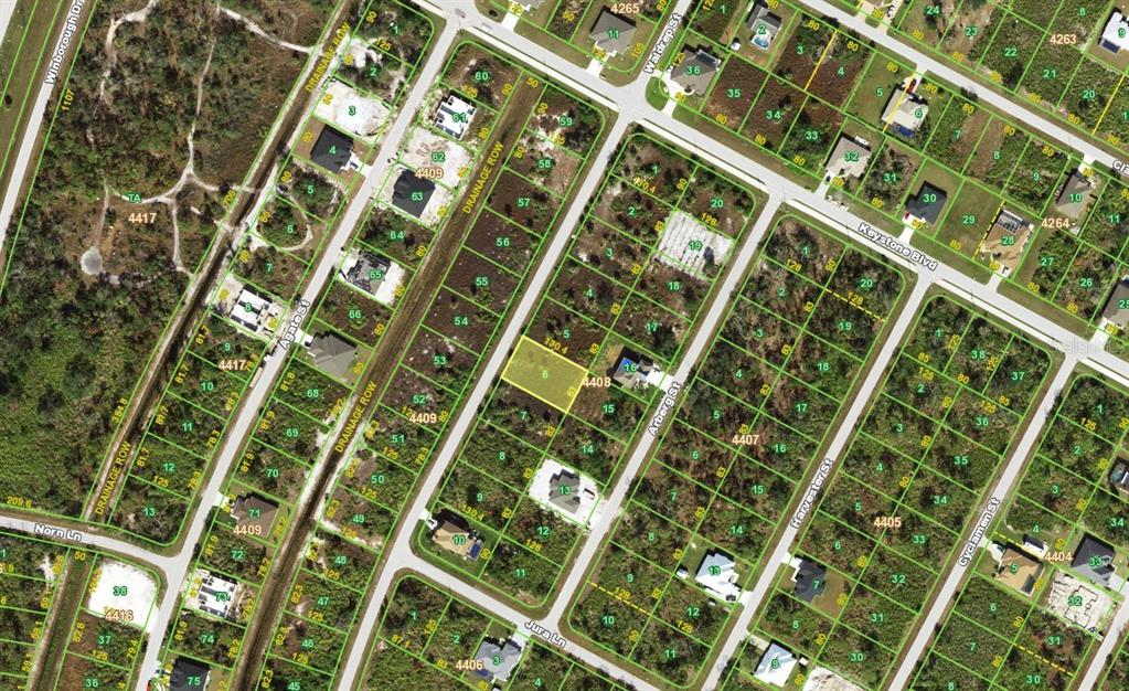 This is an aerial map showing residential lots, streets, and drainage rows in a neighborhood — 9196 WALDREP STREET, PORT CHARLOTTE, FL