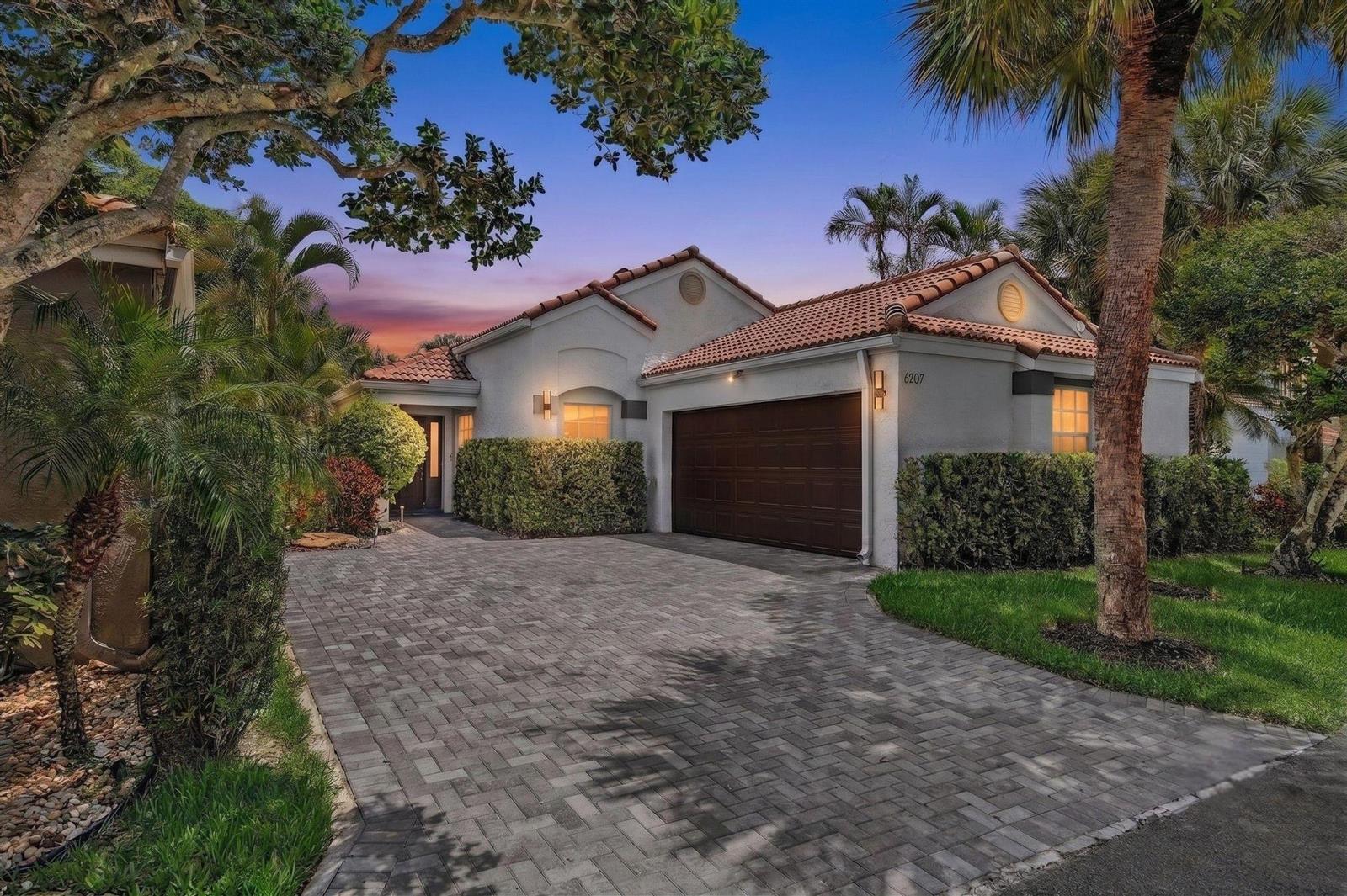 A single-story house with a tiled roof, a paved driveway, and a two-car garage — 6207 La Vida Terrace, Boca Raton FL 33433, BOCA RATON, FL