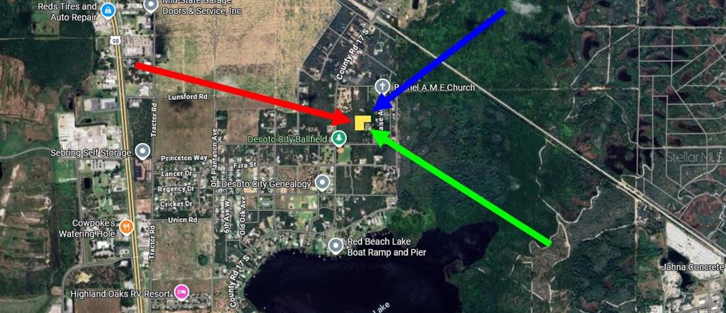 This is a satellite map showing a highlighted property lot near a lake and roads — 6104 OAK BROOK AVENUE LOT 24, SEBRING, FL