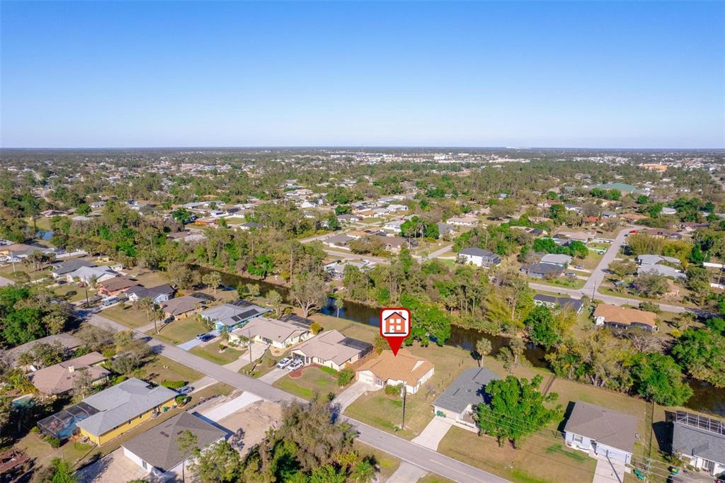 An aerial view shows a suburban neighborhood with a house marked by a red icon — 1224 INVERNESS STREET, PORT CHARLOTTE, FL