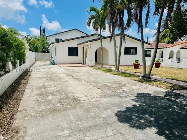 A white single-story house with a concrete driveway and palm trees in the front yard — 11870 SW 5th # 1, Miami FL 33184, MIAMI, FL