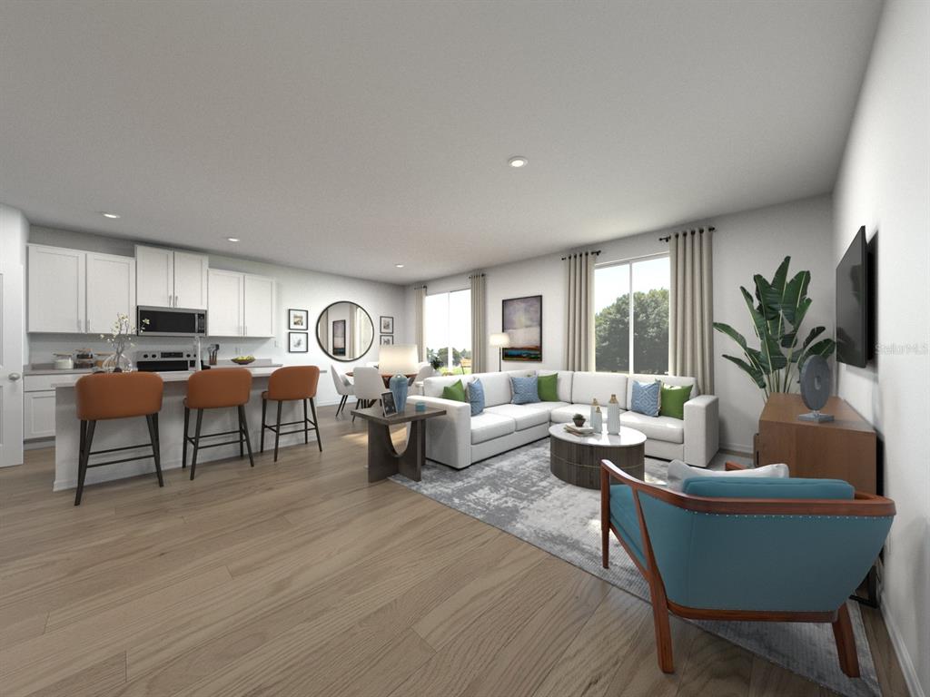 This is a digital rendering of an open-concept living room and kitchen with modern furniture — 1781 FOREST RUN LANE, AUBURNDALE, FL