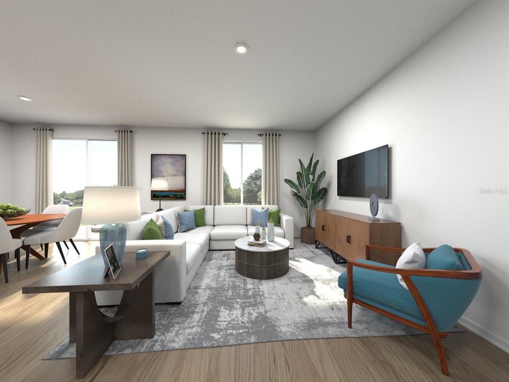 This is a digital rendering of a modern living room with a sectional and accent chair — 1781 FOREST RUN LANE, AUBURNDALE, FL