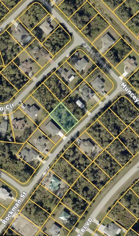 This is an aerial map view of a vacant residential lot outlined in green — ROCKMAN STREET, NORTH PORT, FL