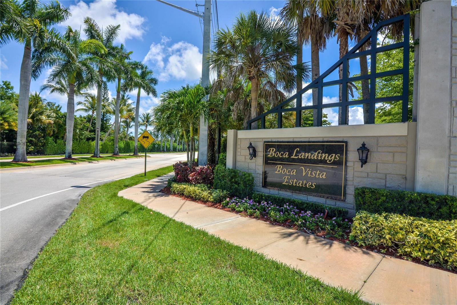 A stone monument sign for Boca Landings and Boca Vista Estates sits beside a road — 18813 Cloud Lake Circle, Boca Raton FL 33496, BOCA RATON, FL