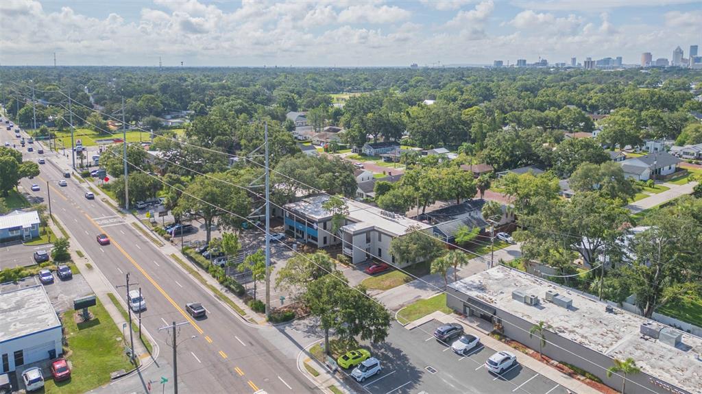 An aerial view shows a commercial building with a parking lot next to a road — 718-722 W DR MARTIN LUTHER KING JR BOULEVARD, TAMPA, FL