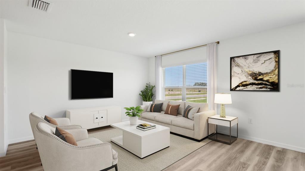 This is a digital rendering of a living room with light flooring and neutral furniture — 12322 HOPSCOTCH AVENUE, PARRISH, FL