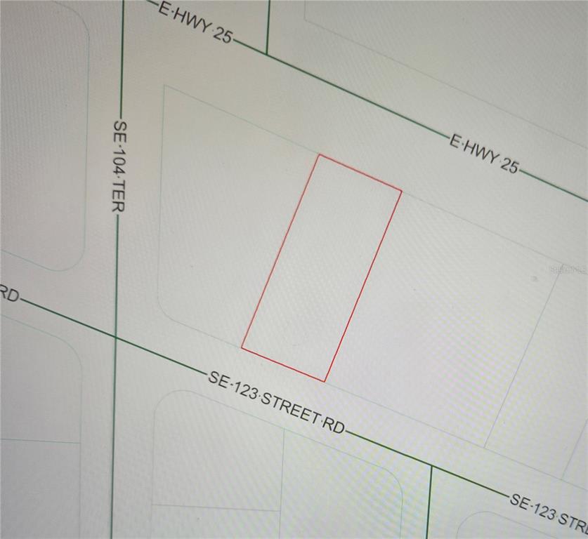 This is a map showing a rectangular property parcel outlined in red near a road intersection — E HWY 25, BELLEVIEW, FL