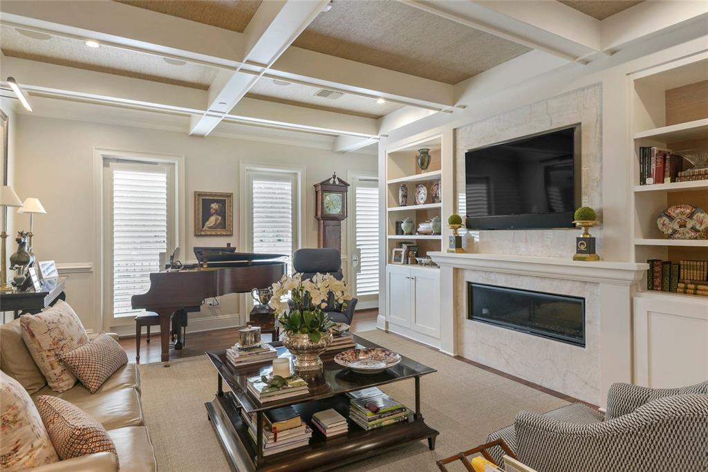 A living room features a fireplace, built-in shelving, a grand piano, and a coffered ceiling — 413 W MORSE BOULEVARD, WINTER PARK, FL
