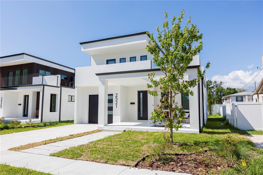 A modern two-story white house with a flat roof and a front porch — 2521 18TH AVENUE N, ST PETERSBURG, FL
