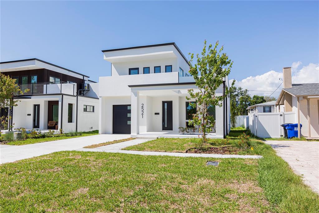 A modern two-story white house with a flat roof and a front porch — 2521 18TH AVENUE N, ST PETERSBURG, FL