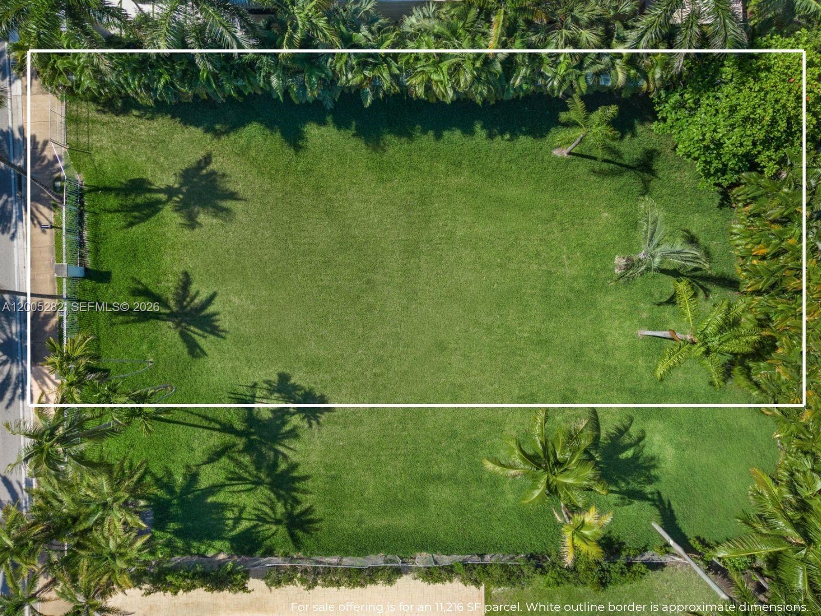 An aerial view shows a rectangular, grass-covered vacant lot outlined in white — 254 Ocean Blvd, Golden Beach FL 33160, GOLDEN BEACH, FL