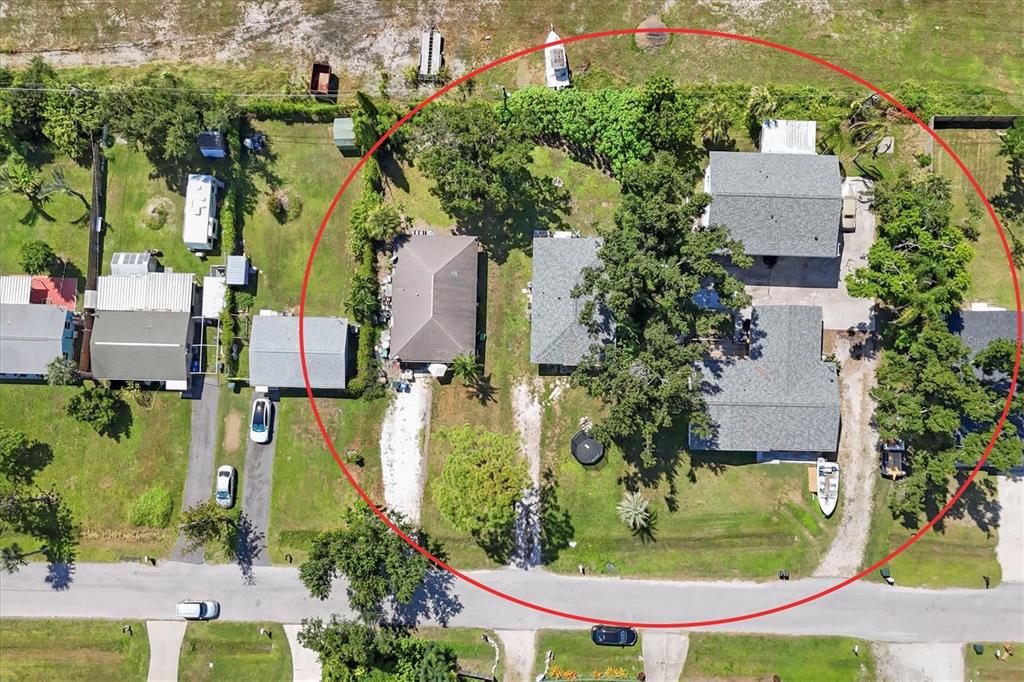 An aerial view shows multiple houses on a large lot with trees and driveways — 2210,2212,2214 PARK ROAD, VENICE, FL