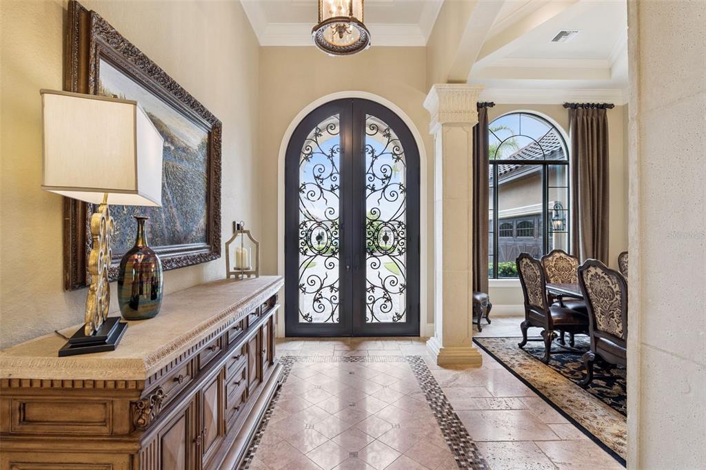 A living room features a grand piano, a fireplace, a bar area, and tile flooring — 25608 GRANDVIEW POINTE, SORRENTO, FL
