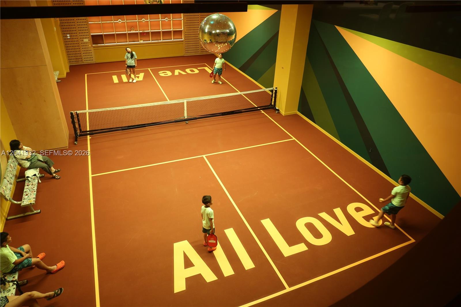 An indoor pickleball court features a disco ball, painted walls, and "All Love" floor lettering — 90 NE 32nd St # 802, Miami FL 33137, MIAMI, FL