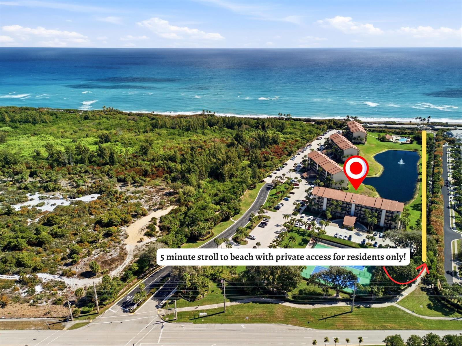 An aerial view shows a residential complex with a pond, tennis courts, and beach access — 401 Ocean Bluffs Boulevard # 104, Jupiter FL 33477, JUPITER, FL