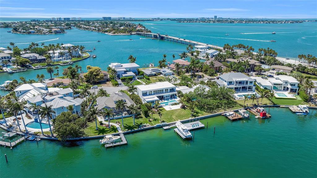 An aerial view of waterfront luxury homes with private docks along a coastal bay — 3631 SAN REMO TERRACE, SARASOTA, FL
