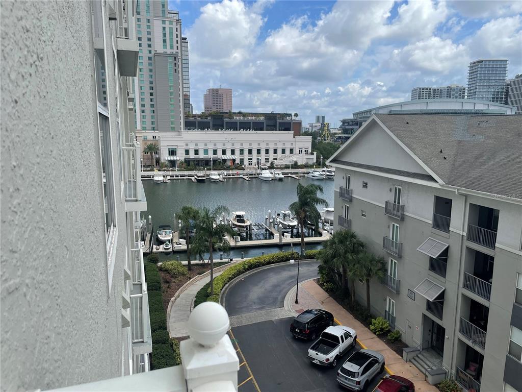 An elevated view of a marina with boats, a parking lot, and surrounding buildings — 700 S HARBOUR ISLAND BOULEVARD UNIT 536, TAMPA, FL